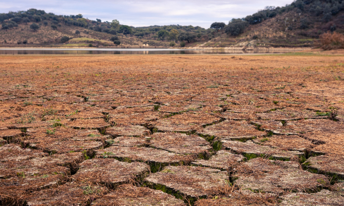 Climate change land with dry and cracked ground in Spain. Soil drought landscape