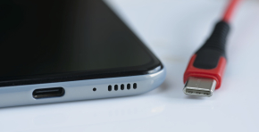 Detail of front entrance of USB versus USB-C cable plugs