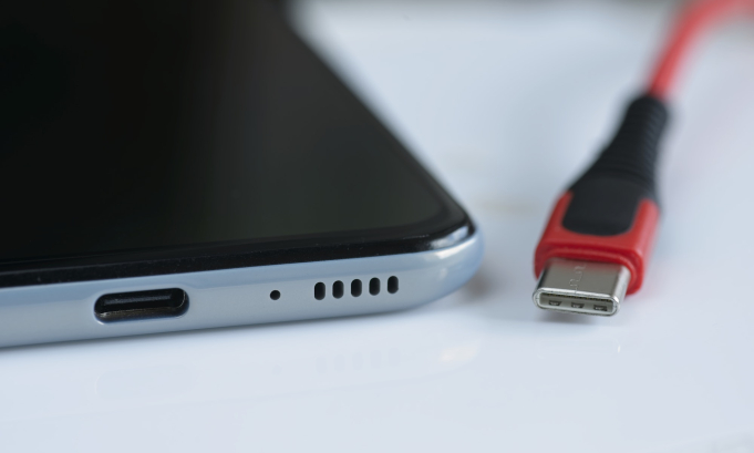 Detail of front entrance of USB versus USB-C cable plugs