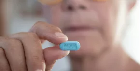 Female doctor holding the pill tablet for the fight against covid-19 coronavirus